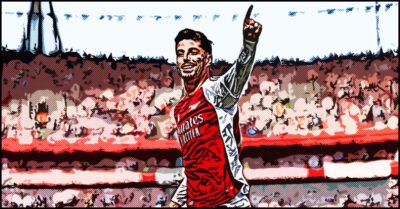 Kai Havertz celebrating passionately after scoring a goal at the Emirates Stadium, arm raised and a triumphant expression,