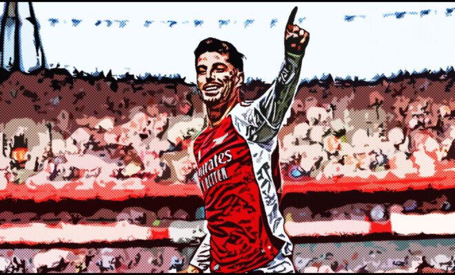 Kai Havertz celebrating passionately after scoring a goal at the Emirates Stadium, arm raised and a triumphant expression,